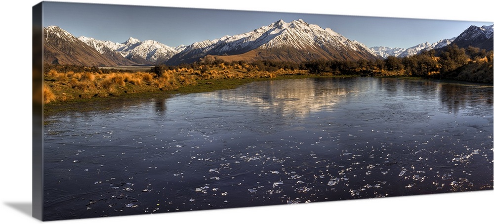 Frozen tarn covered in ice chips, panorama looking up Rangitata river valley, from Mt Sunday, (Edoras village, Kingdom of ...