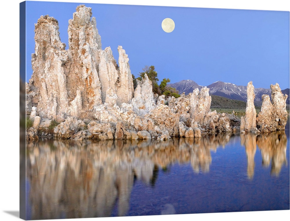 Full moon over Mono Lake with wind and rain eroded tufa towers and the eastern Sierra Nevada Mountains in the background, ...