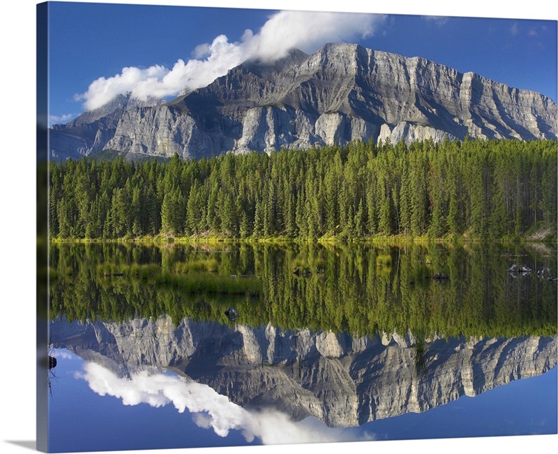 Mount Rundle and boreal forest reflected in Johnson Lake, Banff ...