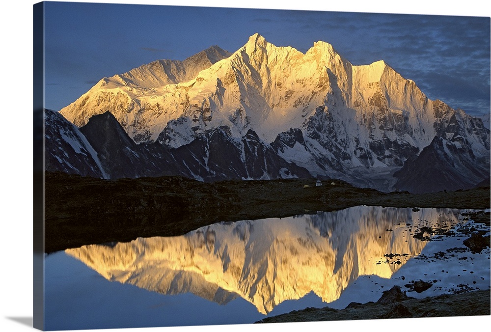 Mt Makalu (8,462 meters) and Mt Chomolonzo (7,540 meters) bathed in dawn light, reflected in small lake, Khama Valley, Tibet