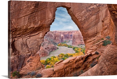 Natural arch with river valley in the background, Arizona