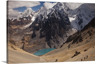 Trekkers descend steep scree slopes from Santa Rosa Pass, Andes, Peru