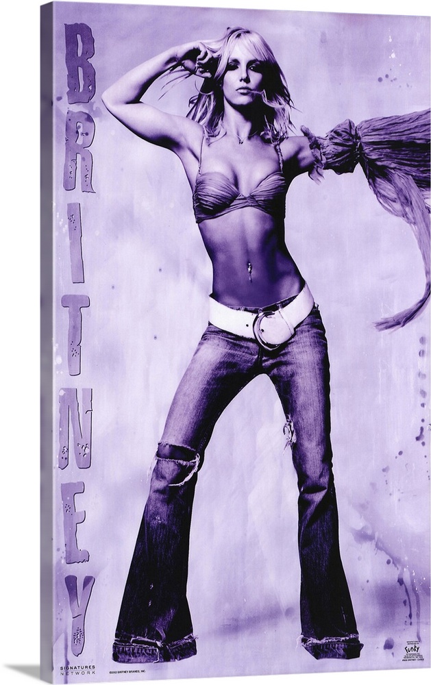 Oversized, vertical music poster on a wall hanging of Britney Spears, standing with arms raised, in tight, bell bottom jea...