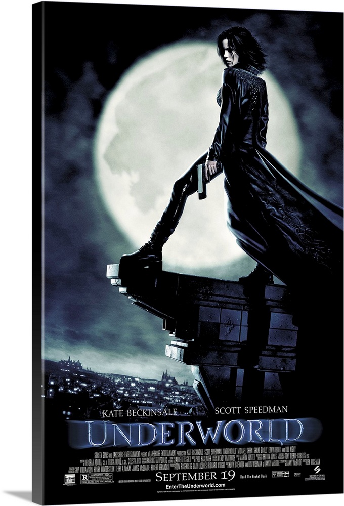 Large, vertical movie advertisement for Underworld, main character Selene stands with a gun in her hand, on the edge of th...