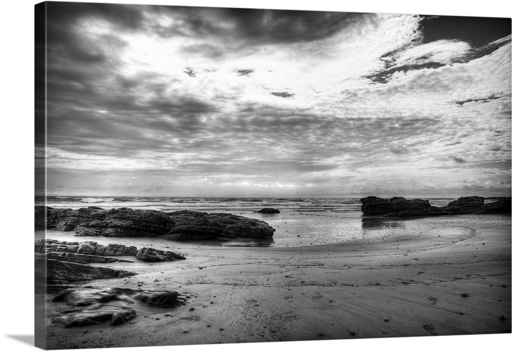Black and white photograph of a dramatic coastal scene.