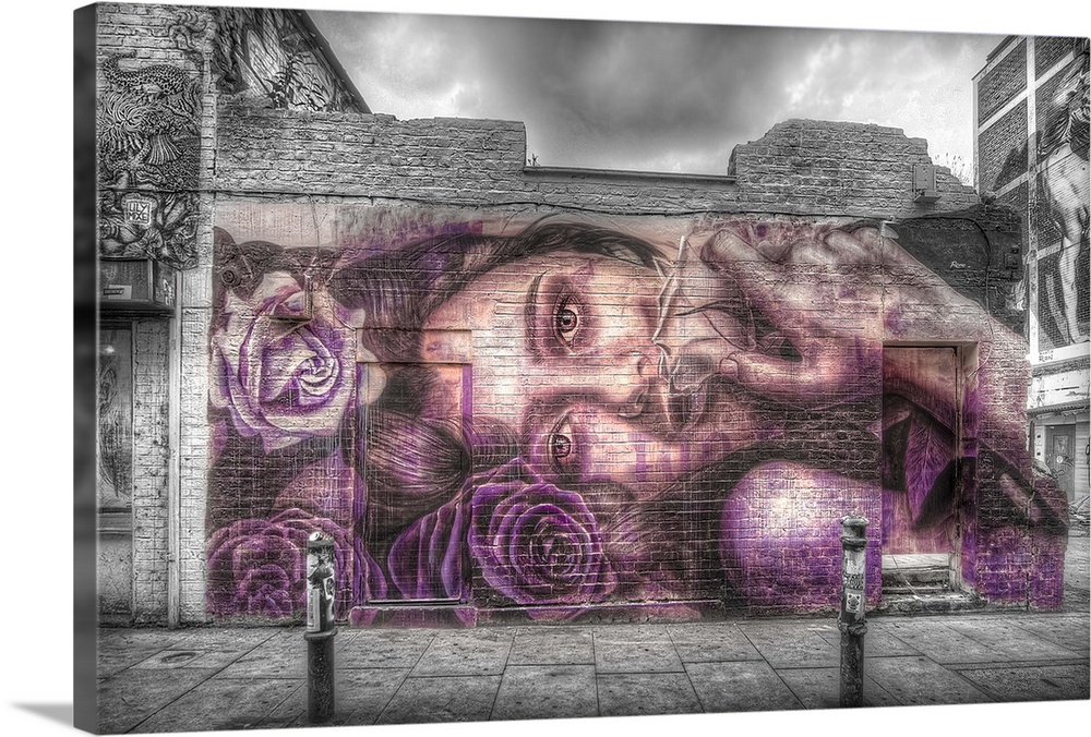 HDR photograph of an urban wall with graffiti on it.