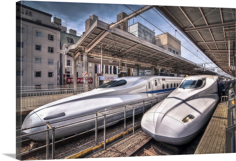 HDR photograph of two bullet trains stopped at a station in Japan.