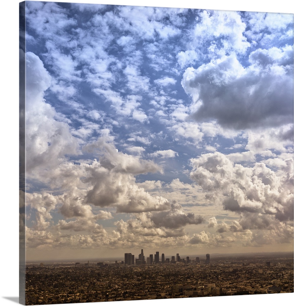 Aerial photograph of the downtown LA area under a blanket of clouds.
