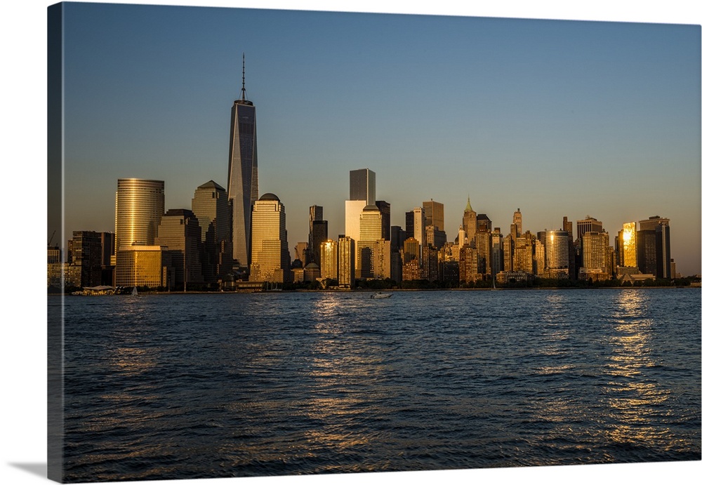 A photograph of the NYC skyline at sunset.