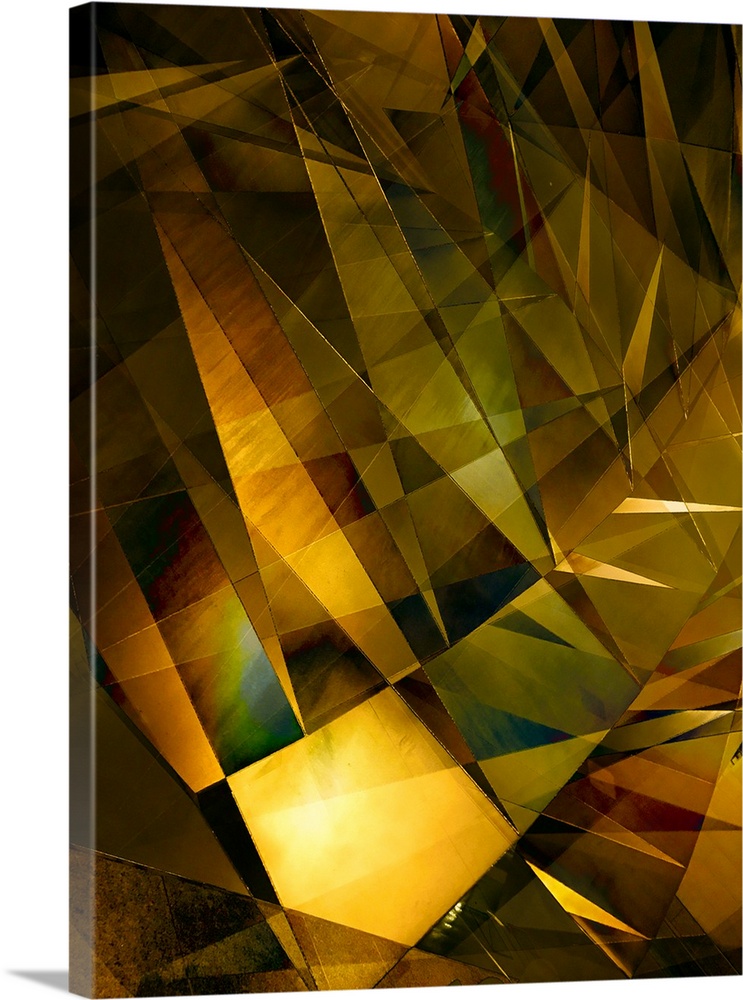 Abstract photograph made of intersecting angles and lines in varying golden shades.