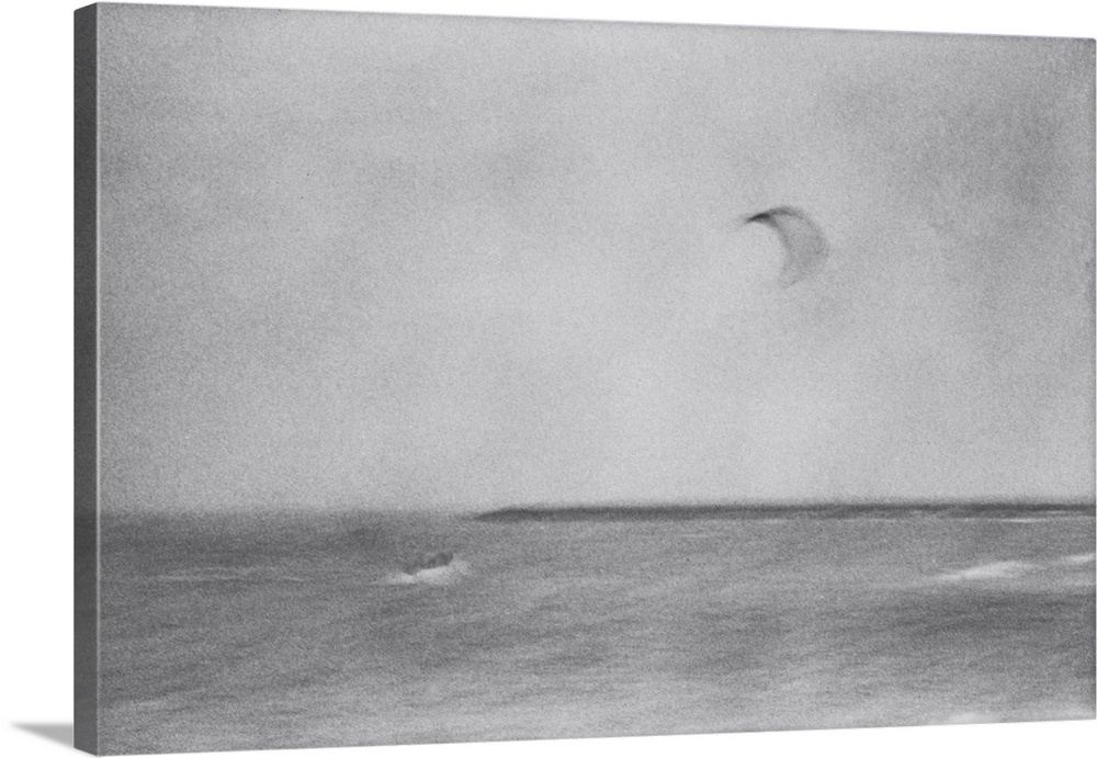 Artistically blurred photo. A kite surfer on the North Sea near the coastal town of Agger, Denmark.