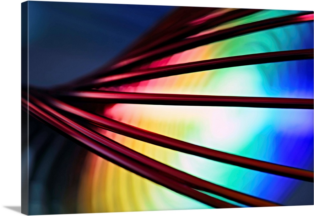 Fine art abstract photograph of cords in front of a rainbow pattern.