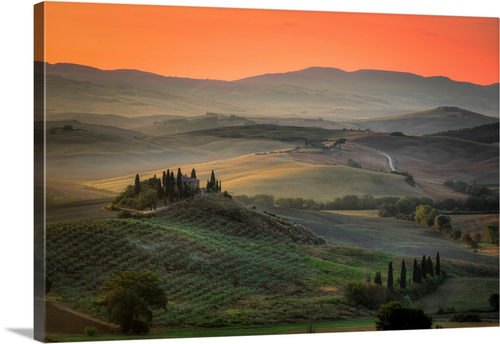 Sunrise in the rolling hill countryside of Tuscany in Italy.