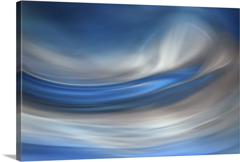 Abstract photograph of blurred and blended colors and flowing lines in shades of blue and white.