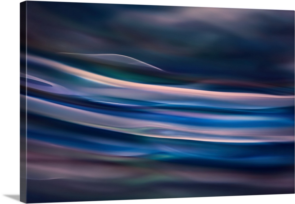 Abstract photograph of blurred and blended colors and flowing lines in shades of blue.