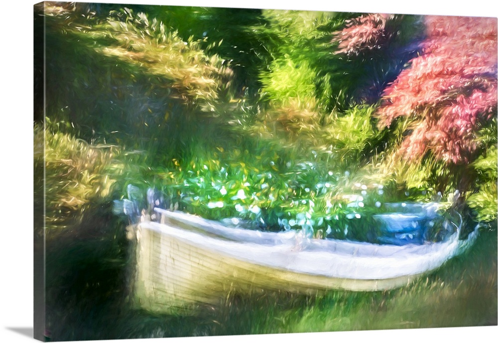 Old boat in a park, filled with flower.