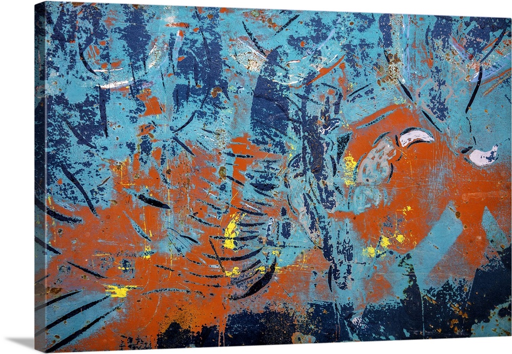 Close up of graffiti on a wall, creating an abstract image in turquoise and orange.