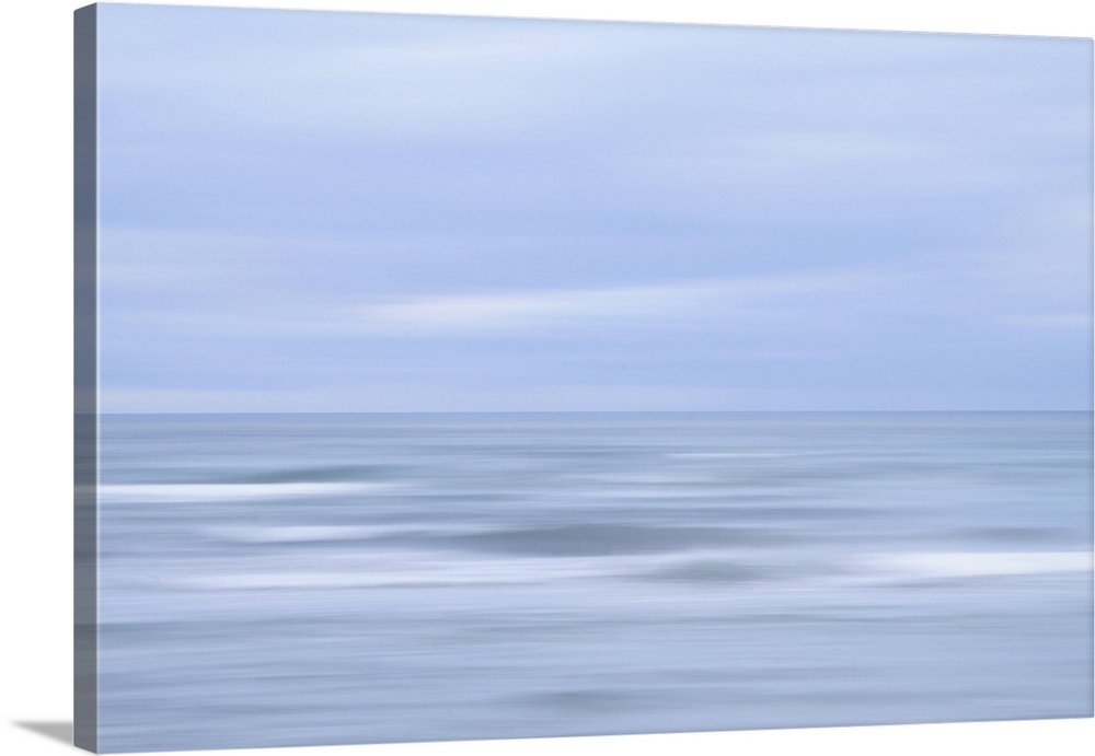 Artistically blurred photo. Late in the afternoon on a cloudy winter day at the coast of the Baltic Sea in south Sweden.