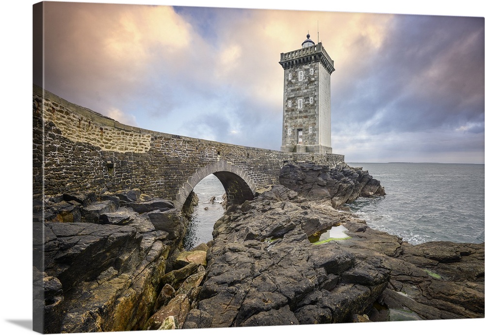 Lighthouse on a rocky coast in France.