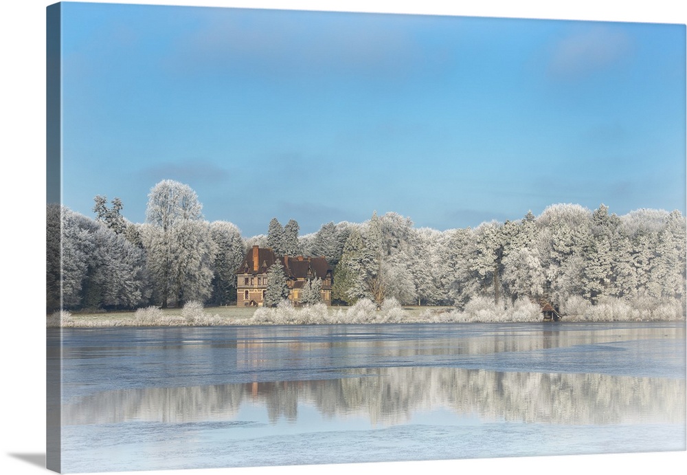 Photograph of a view across the frozen pond from Broceliande Castle.