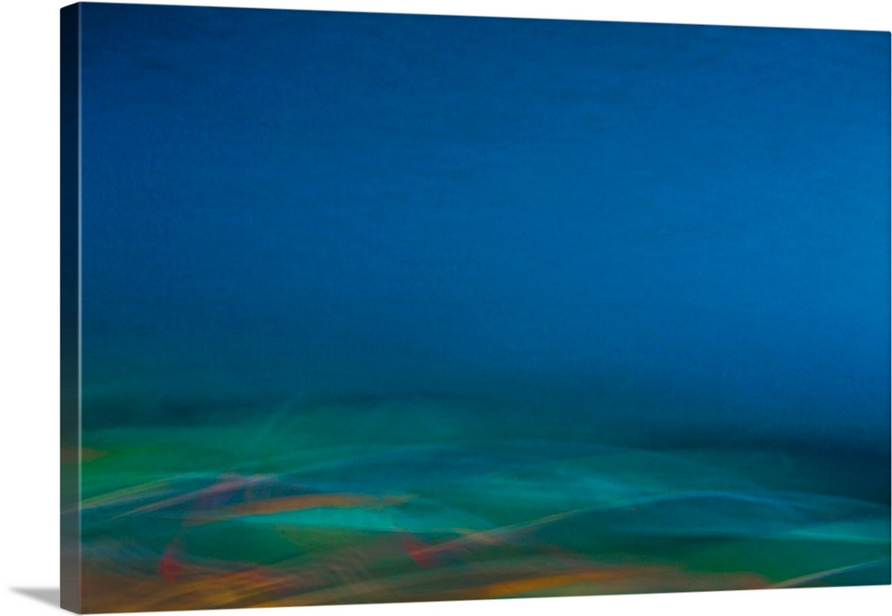 An abstracted seascape of dreamlike flowing blur in deep blues, emerald greens and oranges.