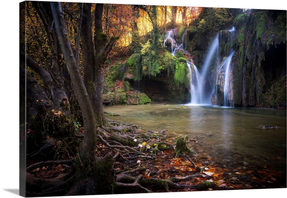 Fine art photograph of a waterfall in a forest in France.
