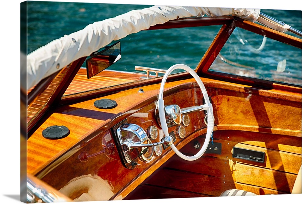 Fine art photo of the polished wood dashboard of a motorboat.