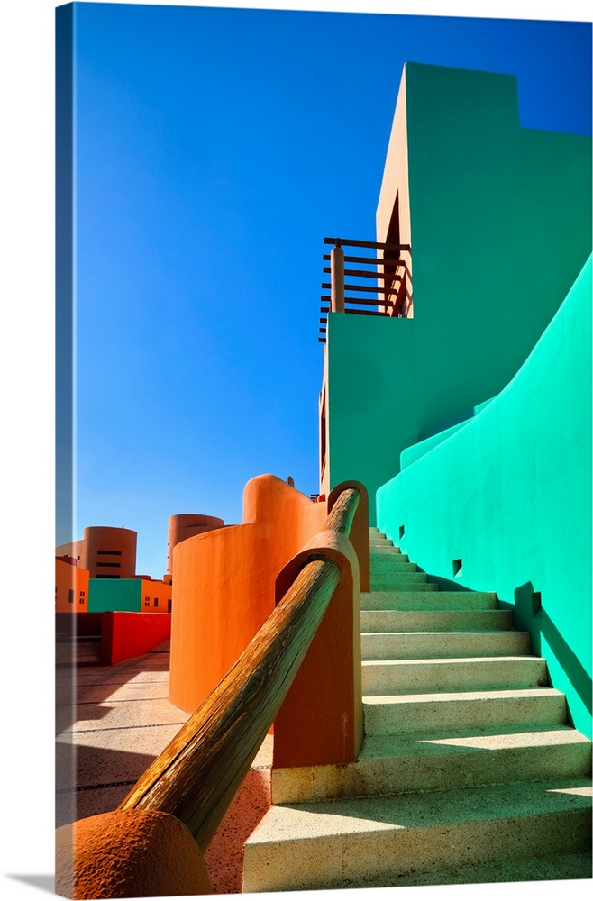 Low angle view of bold colored Mexican style architecture, Cabo San Lucas, Baja California Sur, Mexico.