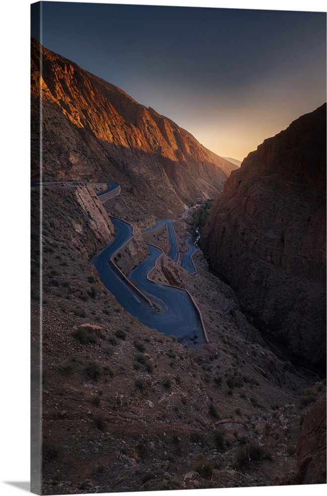 Hairpin curves along Dades Gorge in Morocco during golden hour before sunset.