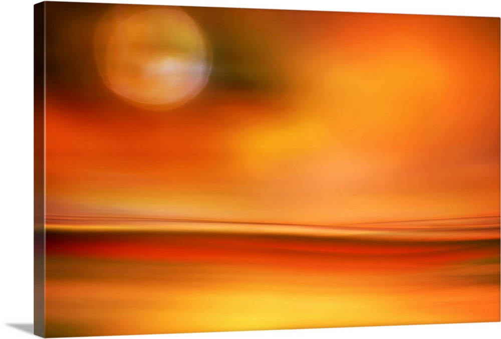 Abstract photo of smooth waves in bright orange tones resembling the moon in the sky over a desert.