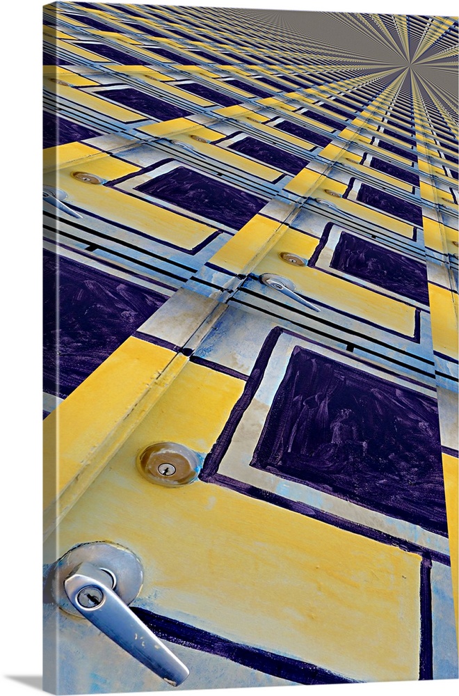 Image of a yellow and blue painted door repeated several times into a pattern, creating an abstract image.
