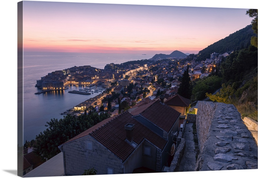 The old town and coastline of Dubrovnik, Croatia, during blue hour after sunset.