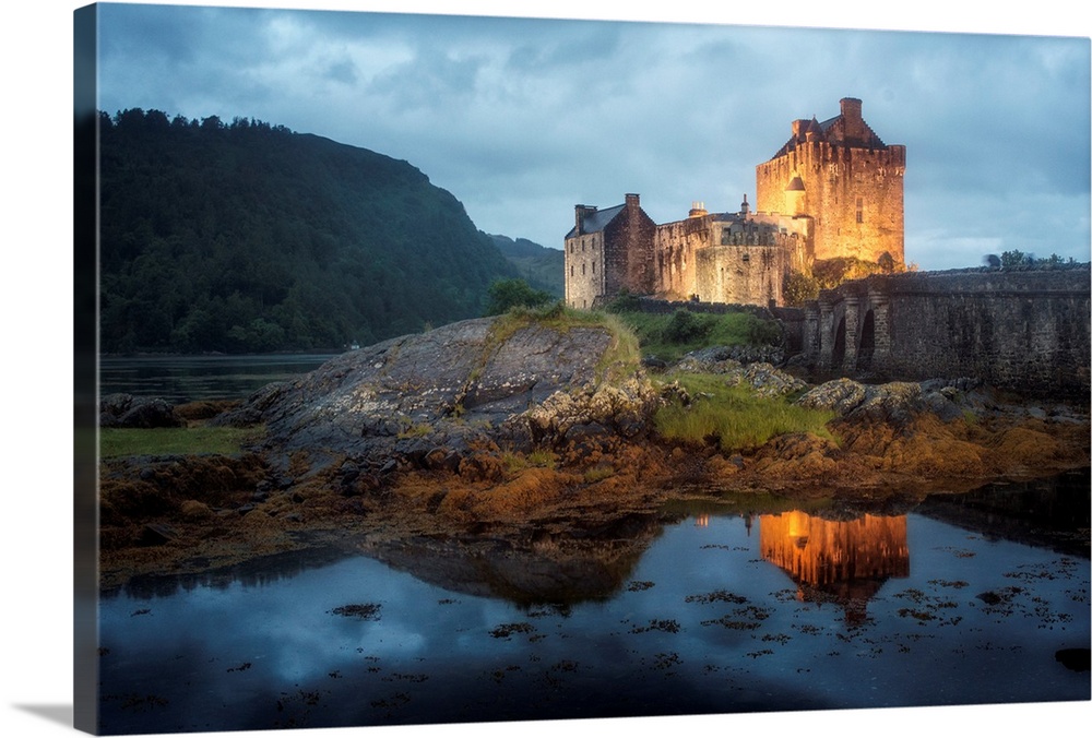 Photograph of old castle on Eilean Donan Island over Loch Duich, with mountains in the distant background,  Dornie Highlan...