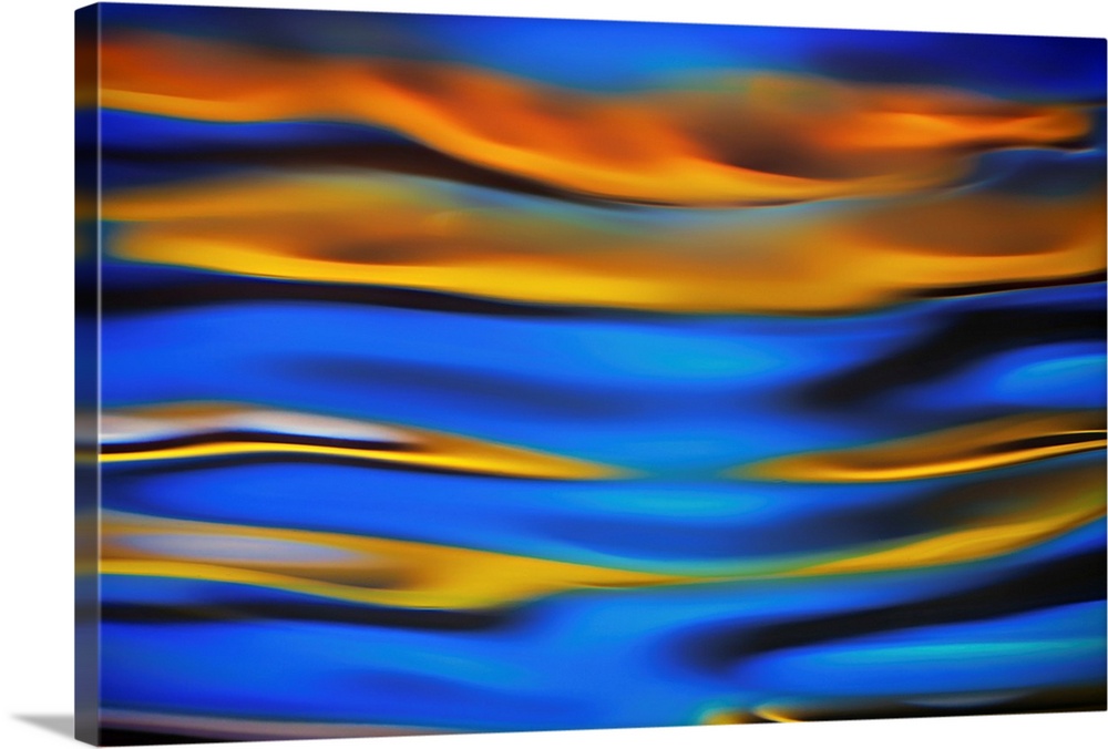 Surreal landscape with waves of reflecting color in yellow, blue, and black.