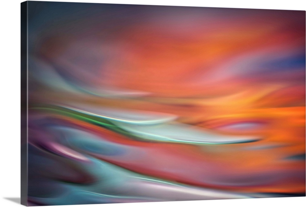 Abstract photo of smooth waves in warm, fiery tones.