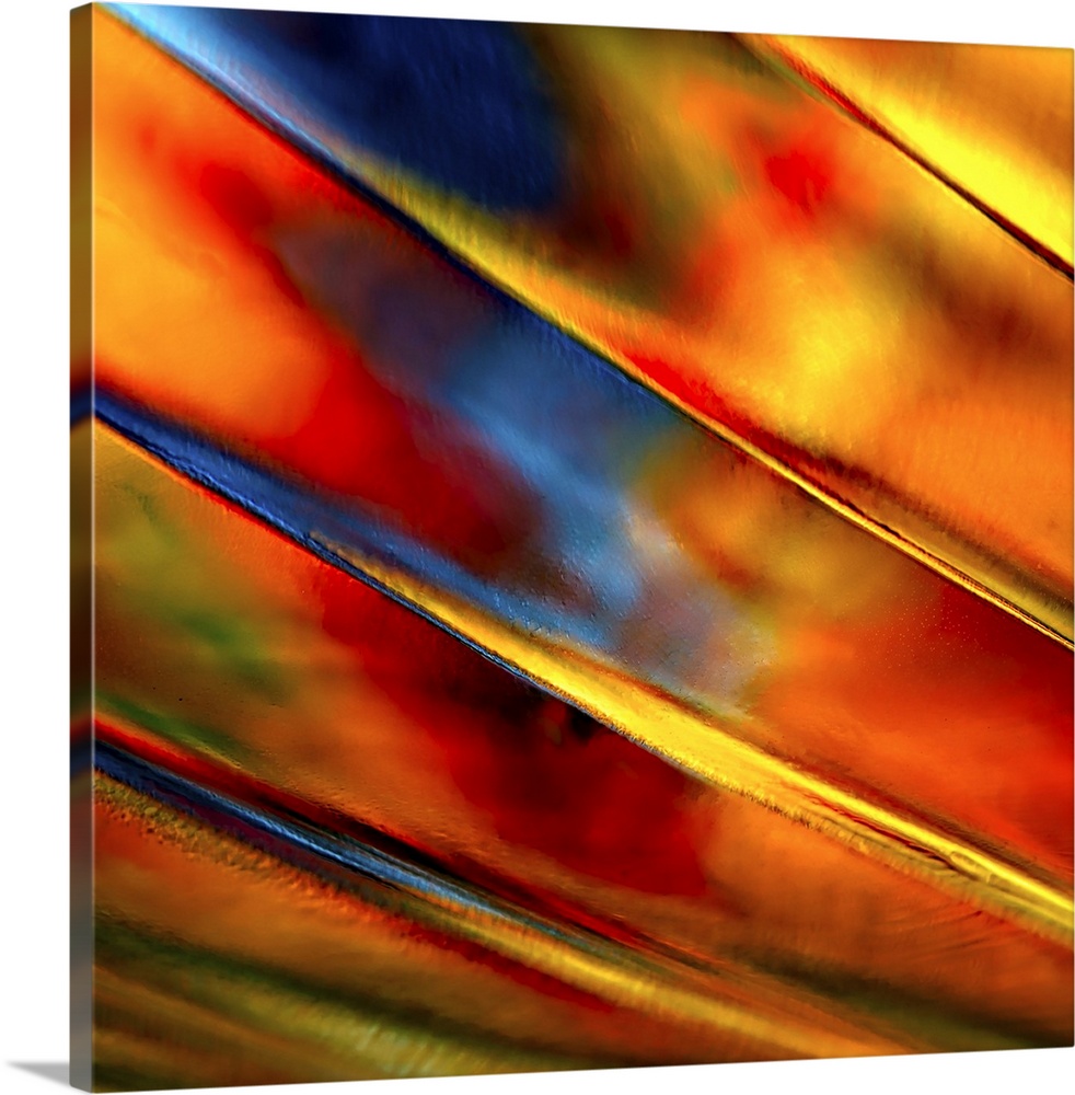 Abstract photograph of orange ridges against red and blue.