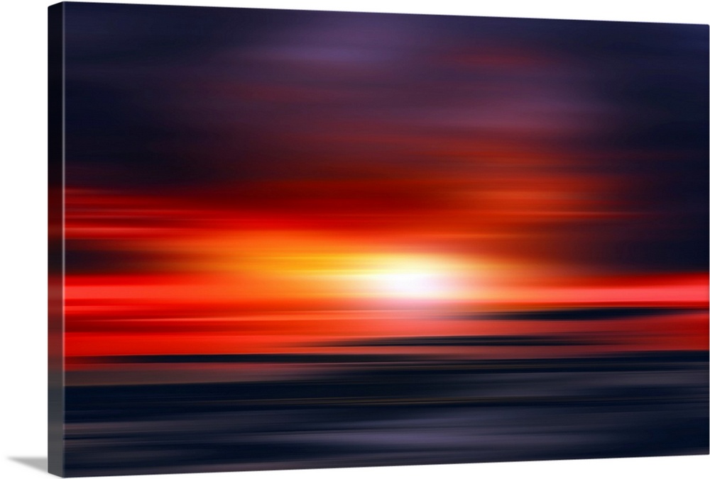 Abstract photograph of a bright red sunset with contrasting dark purple and blue hues above and below.