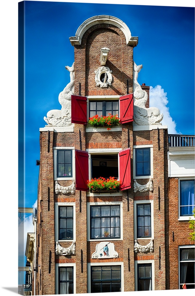 Low angle frontal view of an Old Typical Dutch House, Amsterdam, North Holland, Netherlands.