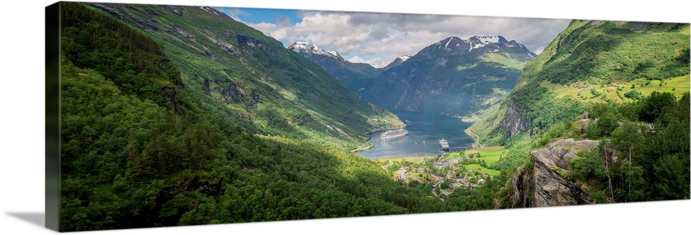 Panoramic photograph of a stunning mountain valley scene.