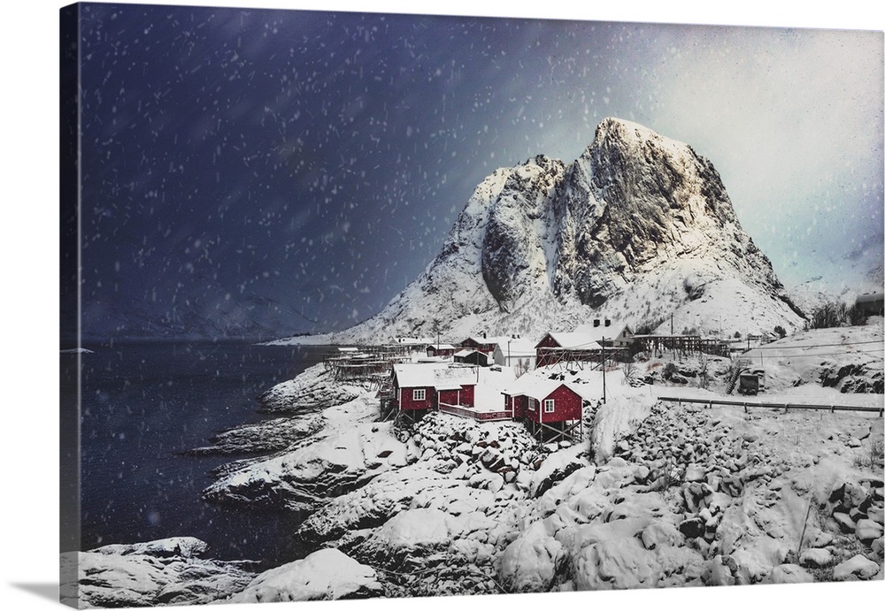 Small Norwegian village with red cabins under the snow