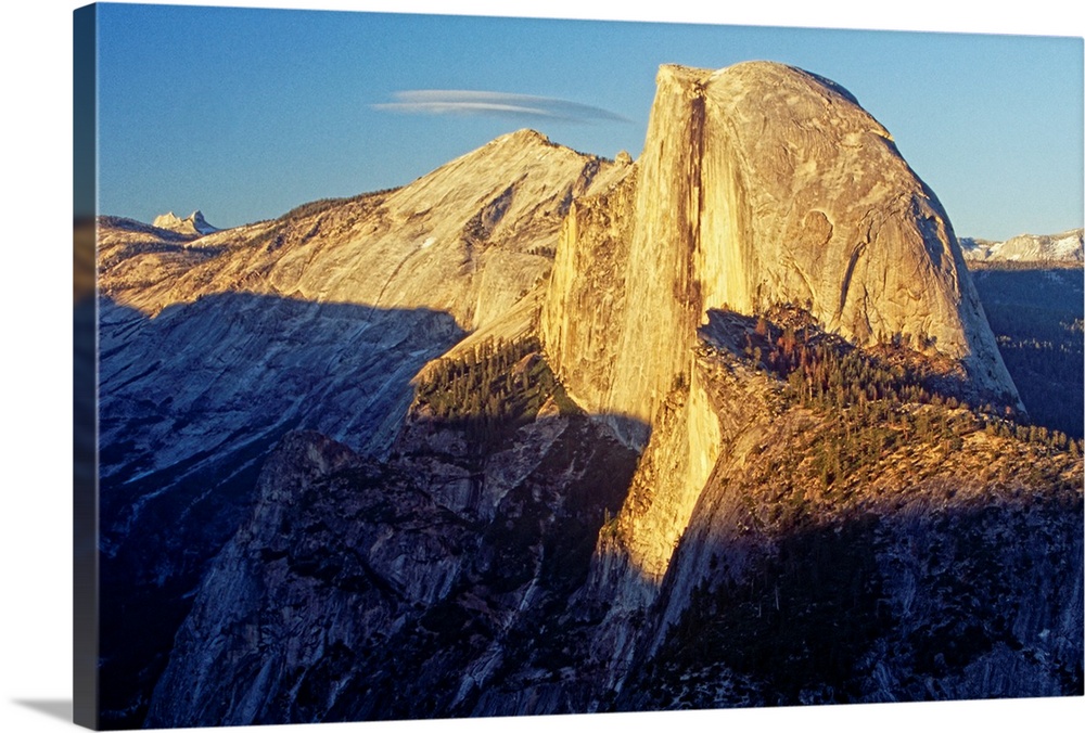 Alpine Glow on Half Dome, Yosemite National Park, California. The morning sun lights up the peak of the mountain before th...