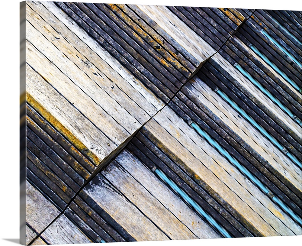 Abstract angle view of weathered wood on the facade of a building.