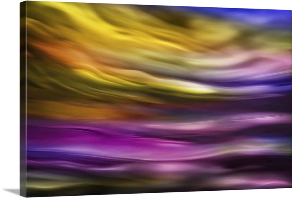 Abstract photograph of blurred and blended colors and flowing lines in shades of purple and yellow.