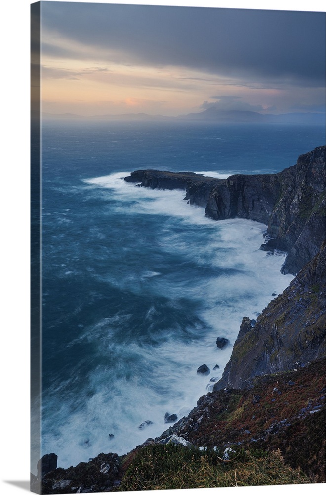 Geokaun Mountain and Cliffs along the Atlantic Coast in Ireland before a sunset storm.