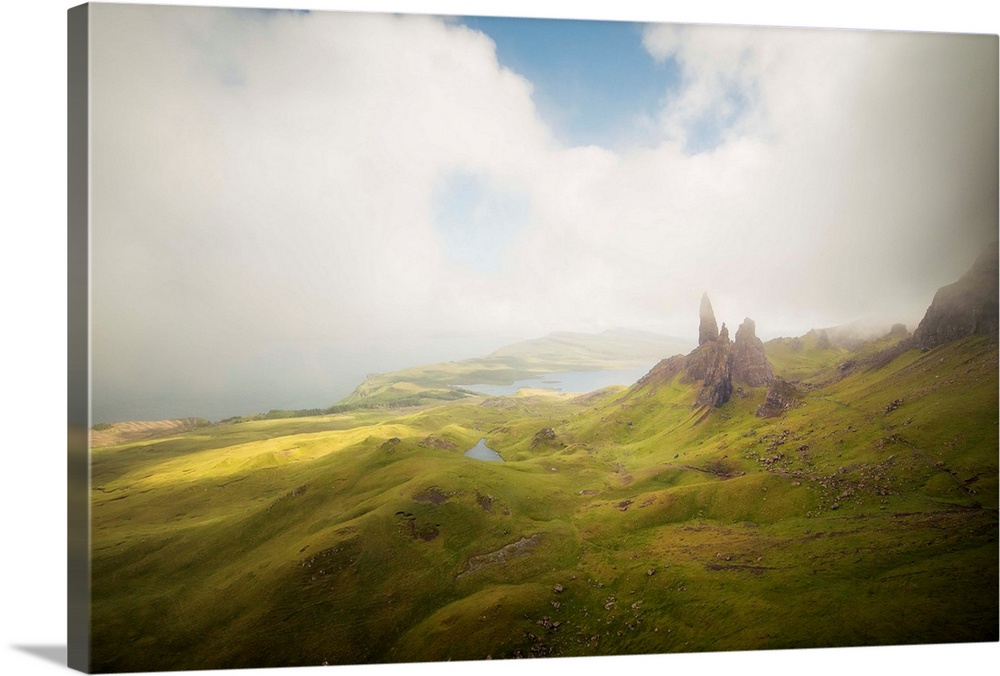 Old Man of Storr peaks moutains on  Trotternish Peninsula, Isle of Skye, Scotland, with clouds shadows on the green valley