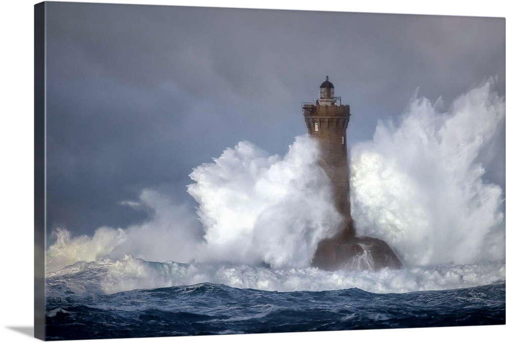Large wave crashing onto a lighthouse in France.