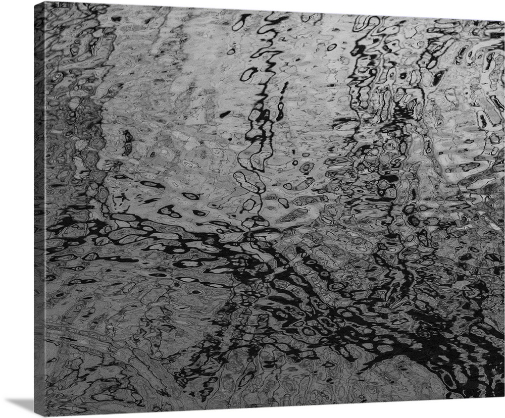A black and white photograph of rippled water.