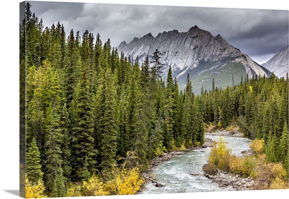 A delightful scene of Maligne River leading towards Grisette Mtn in Jasper, Alberta.