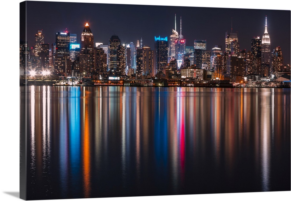 Long exposure of Manhattan, NYC and its rainbow reflection in the Hudson River.