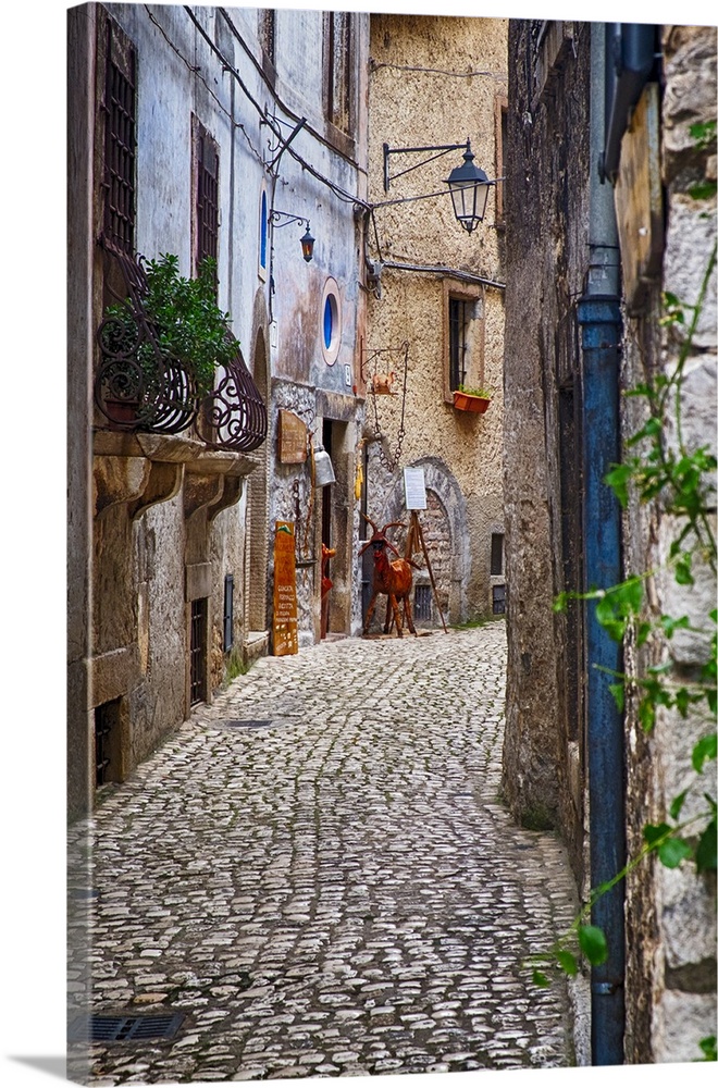 Narrow Cobblestone Street in a Medieval Town With a Cheese Shop, Sermoneta, Latina, Italy.